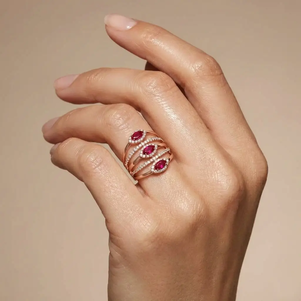 Alma Ring in pink gold with marquise rubies and diamond halo pavé bands