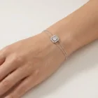 Aurelle Bracelet white gold with 3 baguette diamonds in an illusion setting and diamond halo