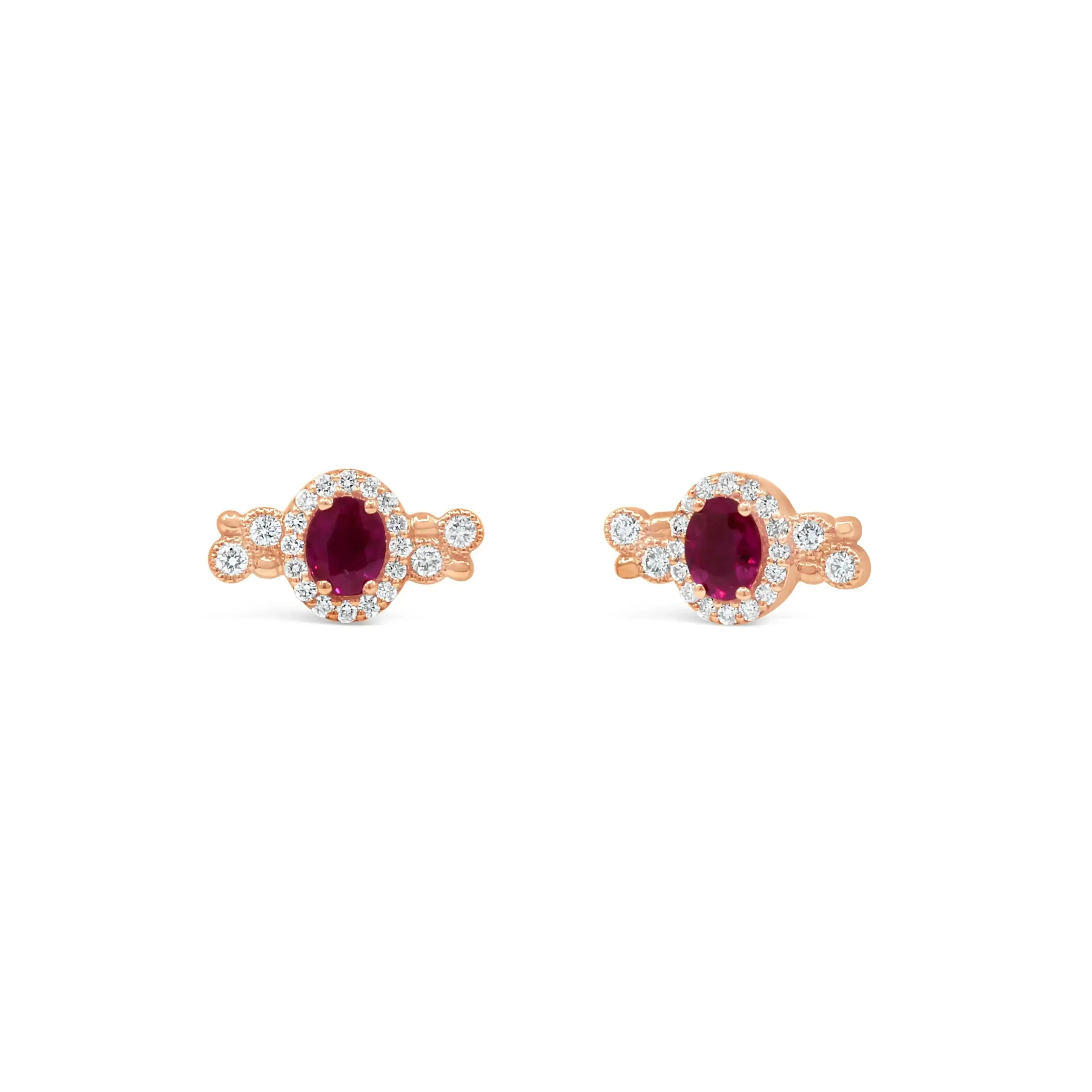 dotted-ruby-diamond-stud-earrings Dotted ruby diamond stud earrings in 18kt rose gold with oval ruby center and diamond halo