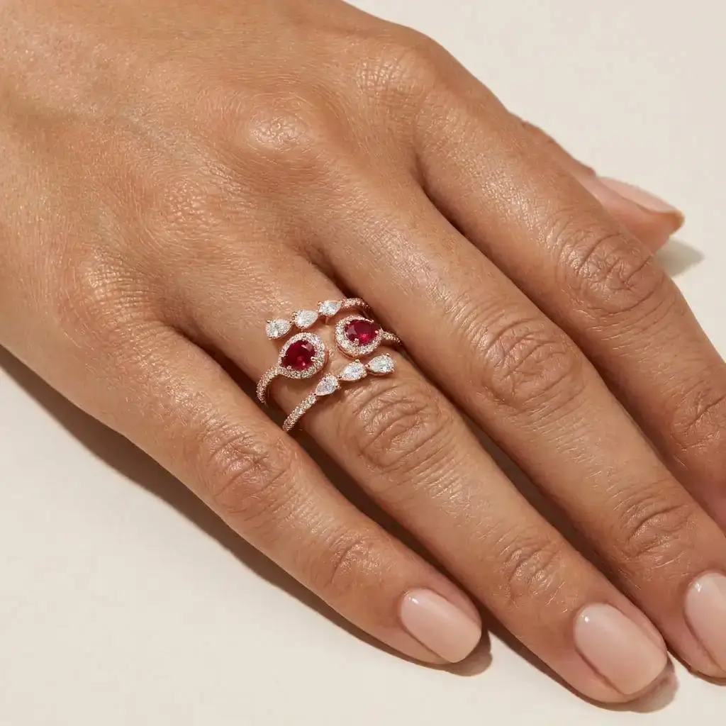 Lei Ring in pink gold with pear-shaped rubies, pear-shaped diamonds, and pavé diamond accents