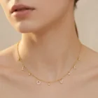 Love Necklace in yellow gold with diamond-set letters and delicate star charms