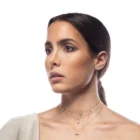 Lula Necklace in pink gold with a star motif, black diamonds, and white diamonds