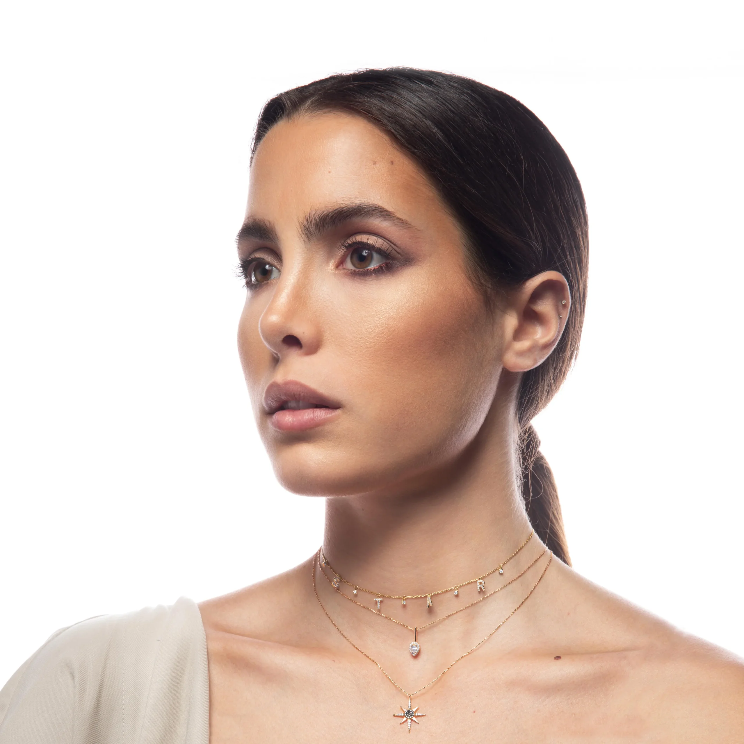Lula Necklace in pink gold with a star motif, black diamonds, and white diamonds