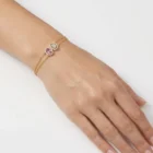 Lunelle Bracelet in yellow gold with a pink sapphire and diamond halo details