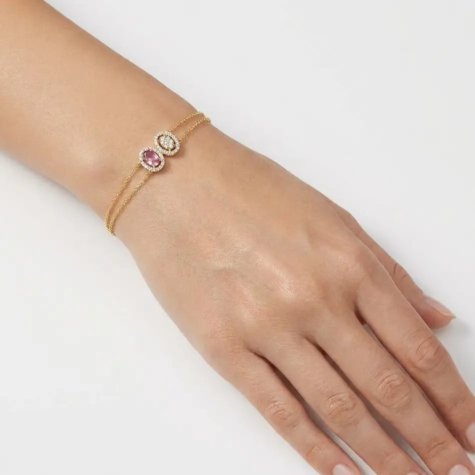 Lunelle Bracelet in yellow gold with a pink sapphire and diamond halo details