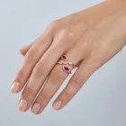 Mada Ring in pink gold with marquise rubies, marquise diamonds, and diamond halo details