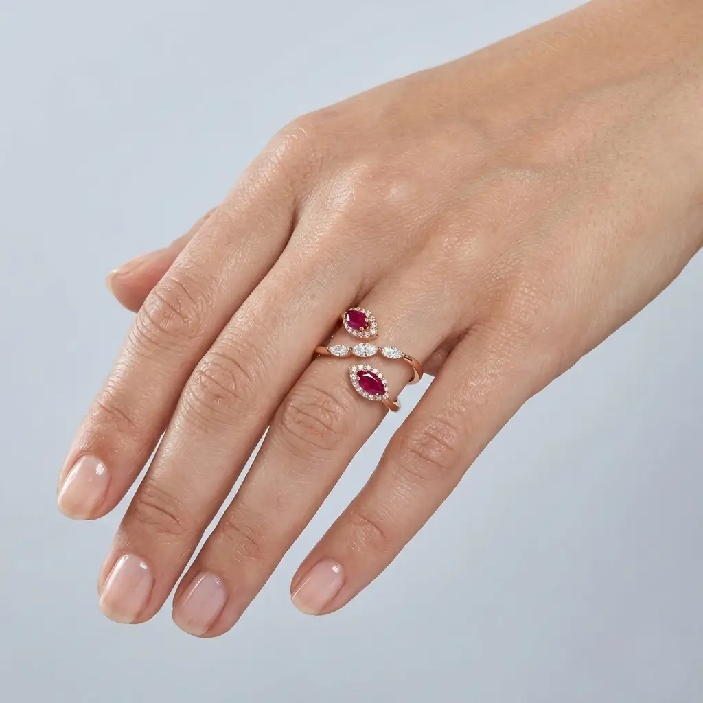 Mada Ring in pink gold with marquise rubies, marquise diamonds, and diamond halo details