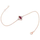 Marquise Ruby Bracelet in pink gold with a marquise ruby and diamond halo