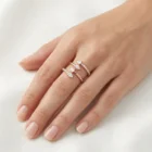 Pera Ring in pink gold with pear-shaped diamonds and pavé diamond accents