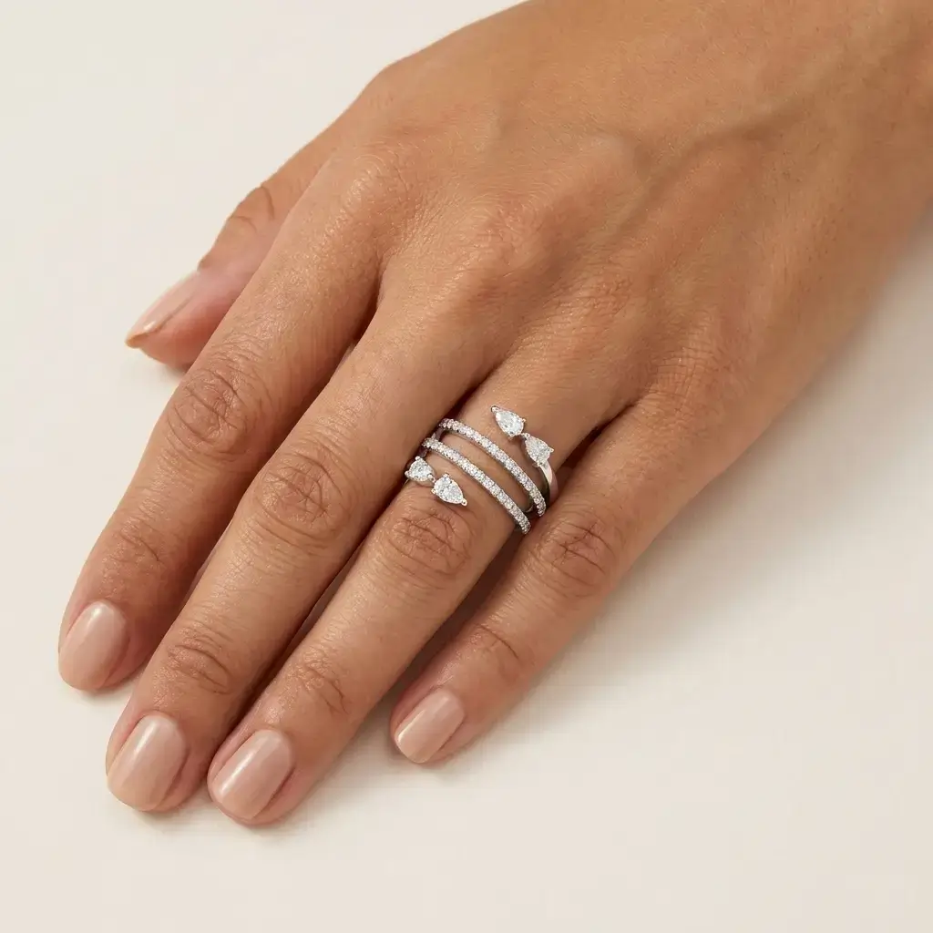 Strati Ring white gold with pavé diamonds and pear-shaped diamond wrap design