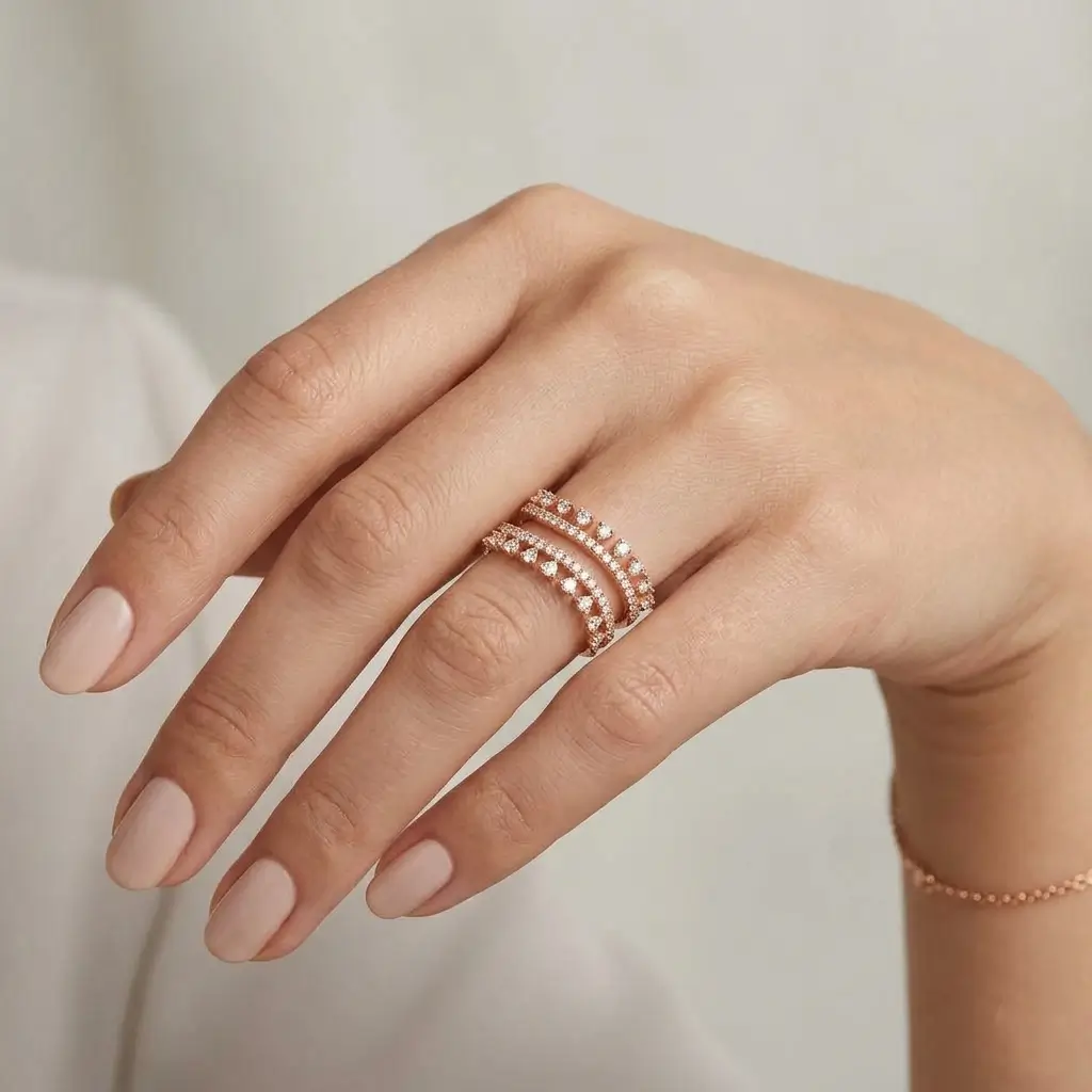 Solace Ring in pink gold with layered round diamond bands and an elegant open wrap design