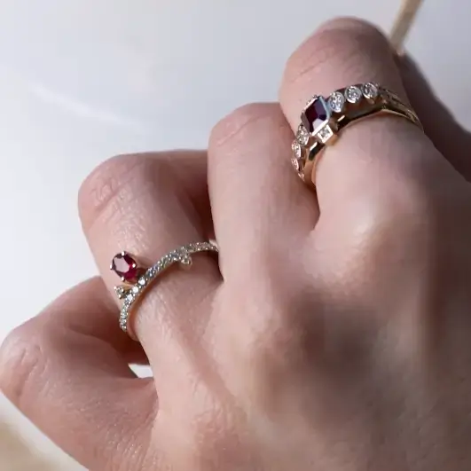 Luce Ruby Ring in yellow gold with an oval ruby and pavé diamond band