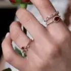 Eclipse Ruby Ring in pink gold with a marquise ruby, diamond halo, and diamond band